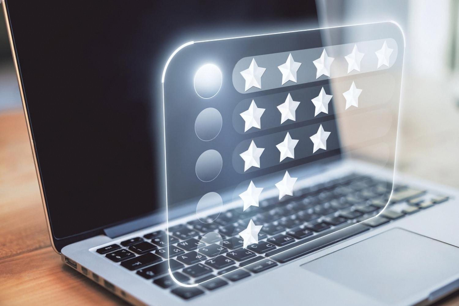Laptop showing hotel online reviews and star ratings representing booking technology